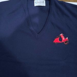 Navy blue v neck sweater made in America with embroidery made in Australia.